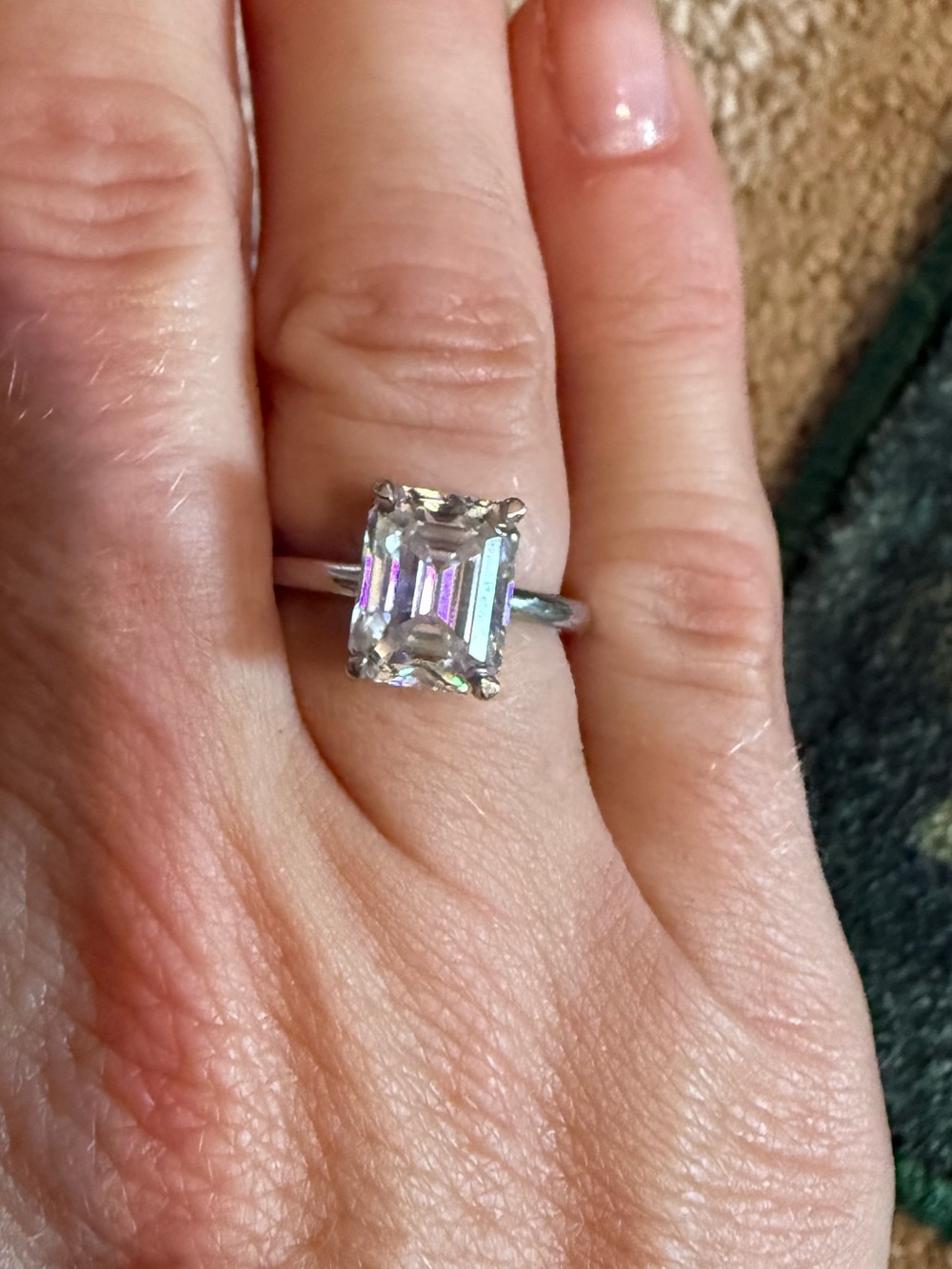 Emerald cut solitaire moissanite ring